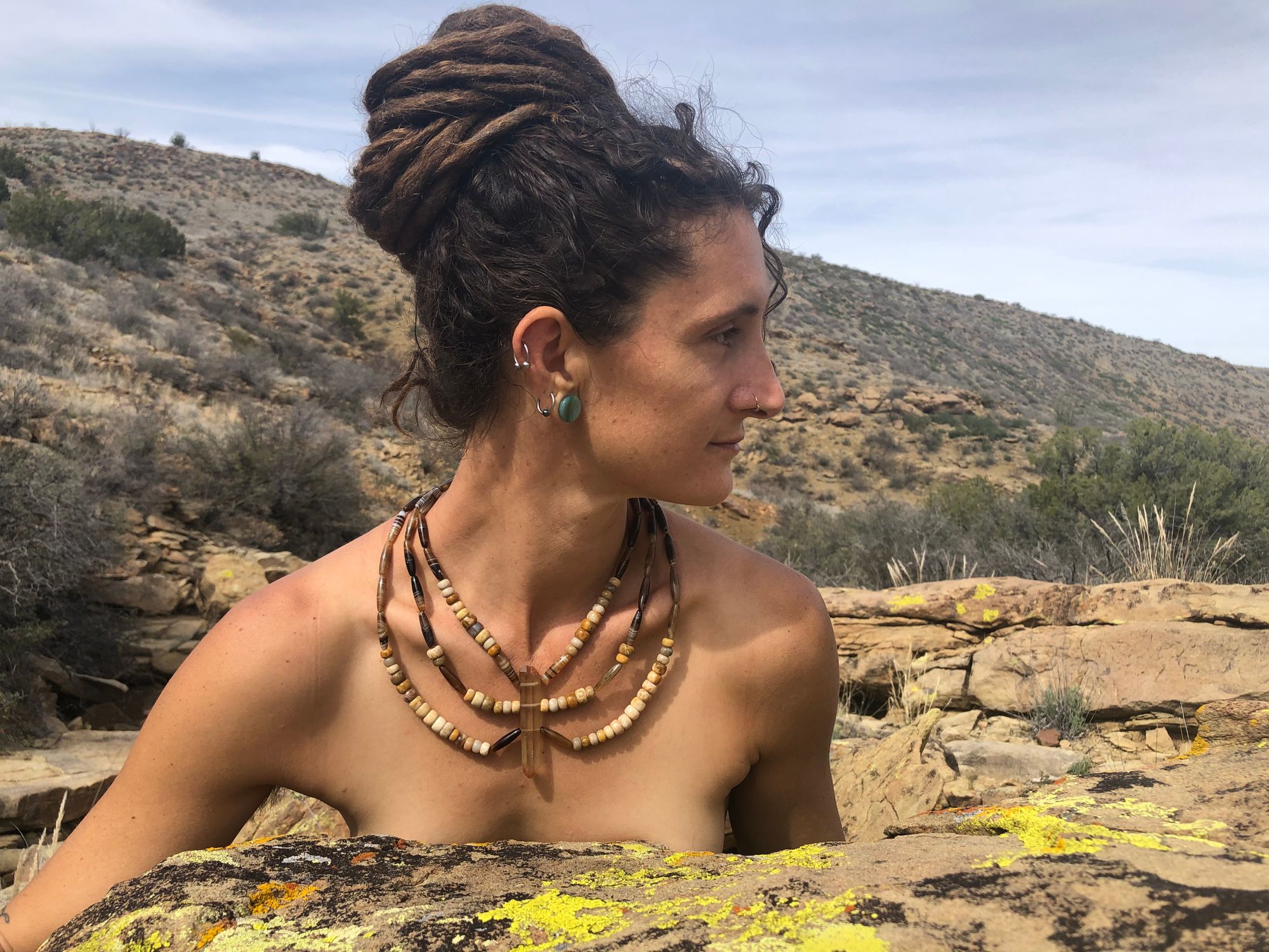 woman wearing Brown necklace made with Zambian citrine, fossilized coral and picture agate 