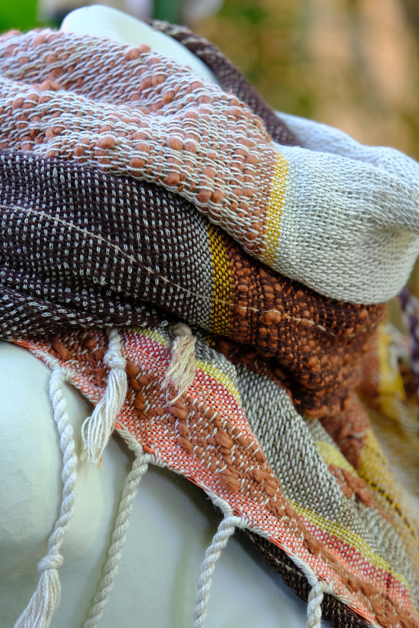 Chunky Cotton & Linen Handwoven Etherial Scarf in brown, blue, yellow and orange on a white mannequin