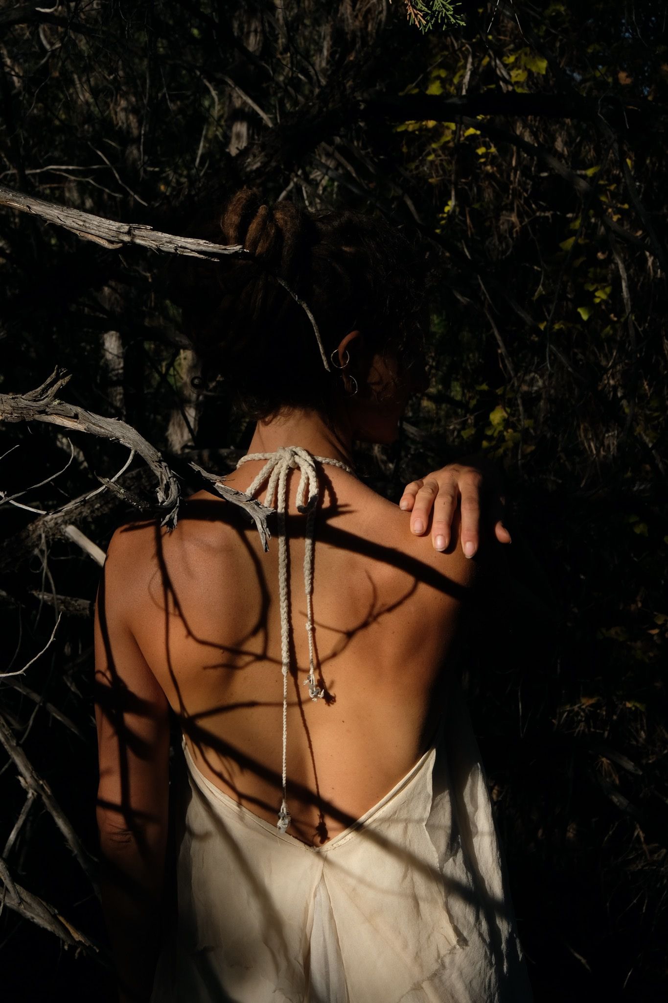 back of woman wearing white layered silk handmade dress