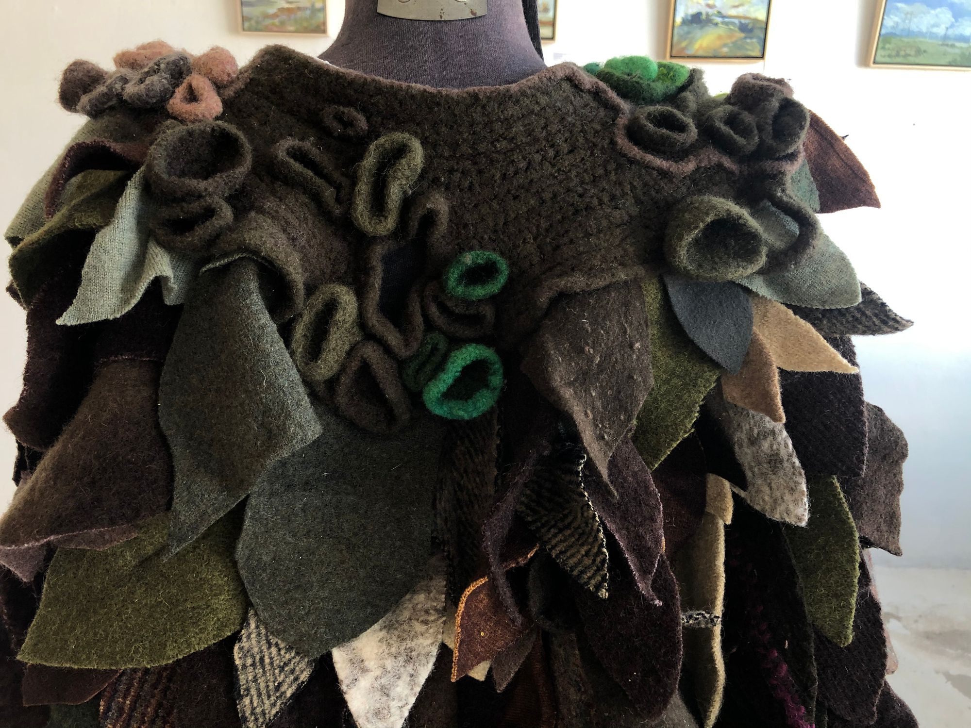 detail of Highly textured green and brown cloak