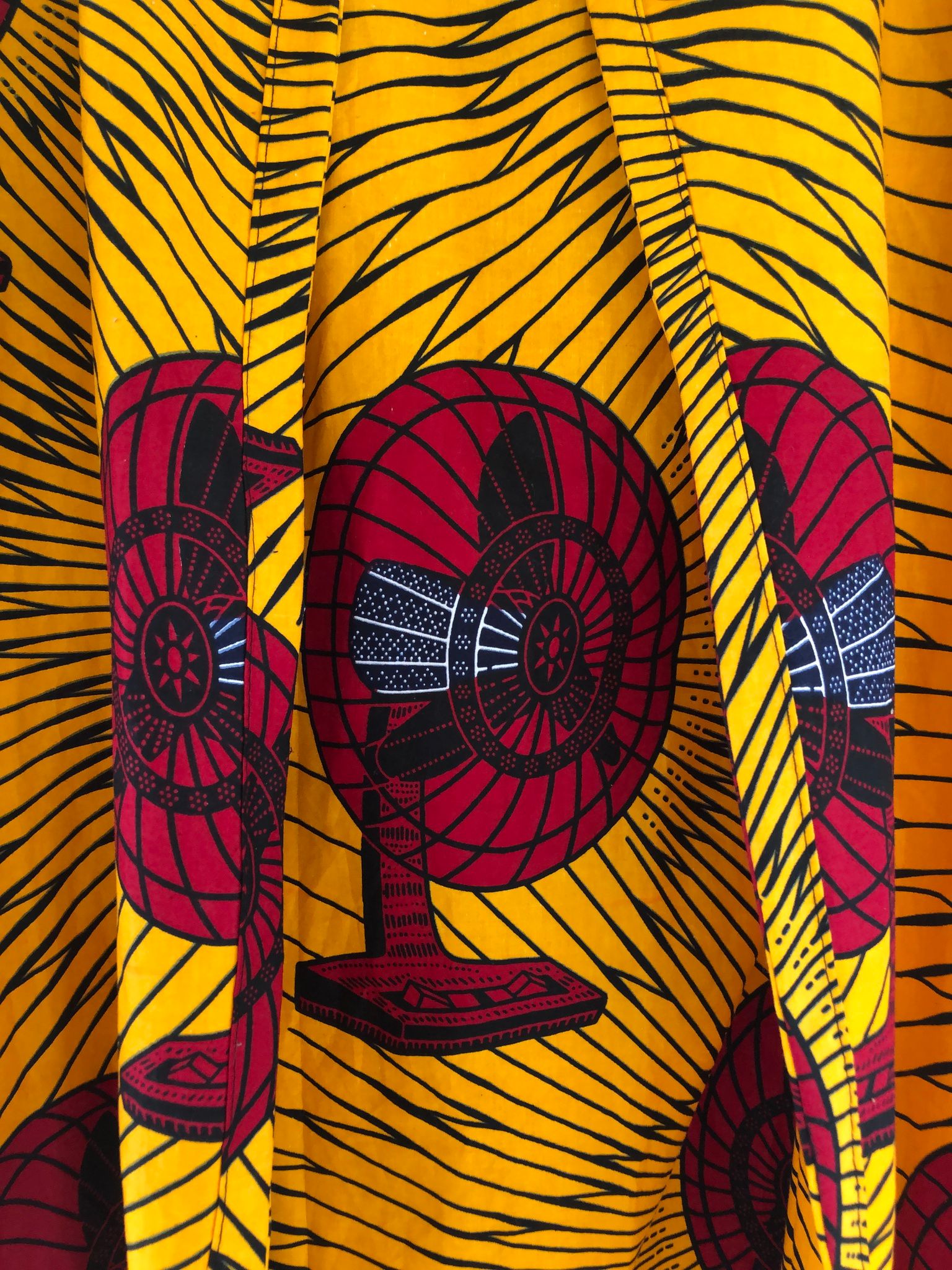 detail of yellow and red fan print hand sewn jacket