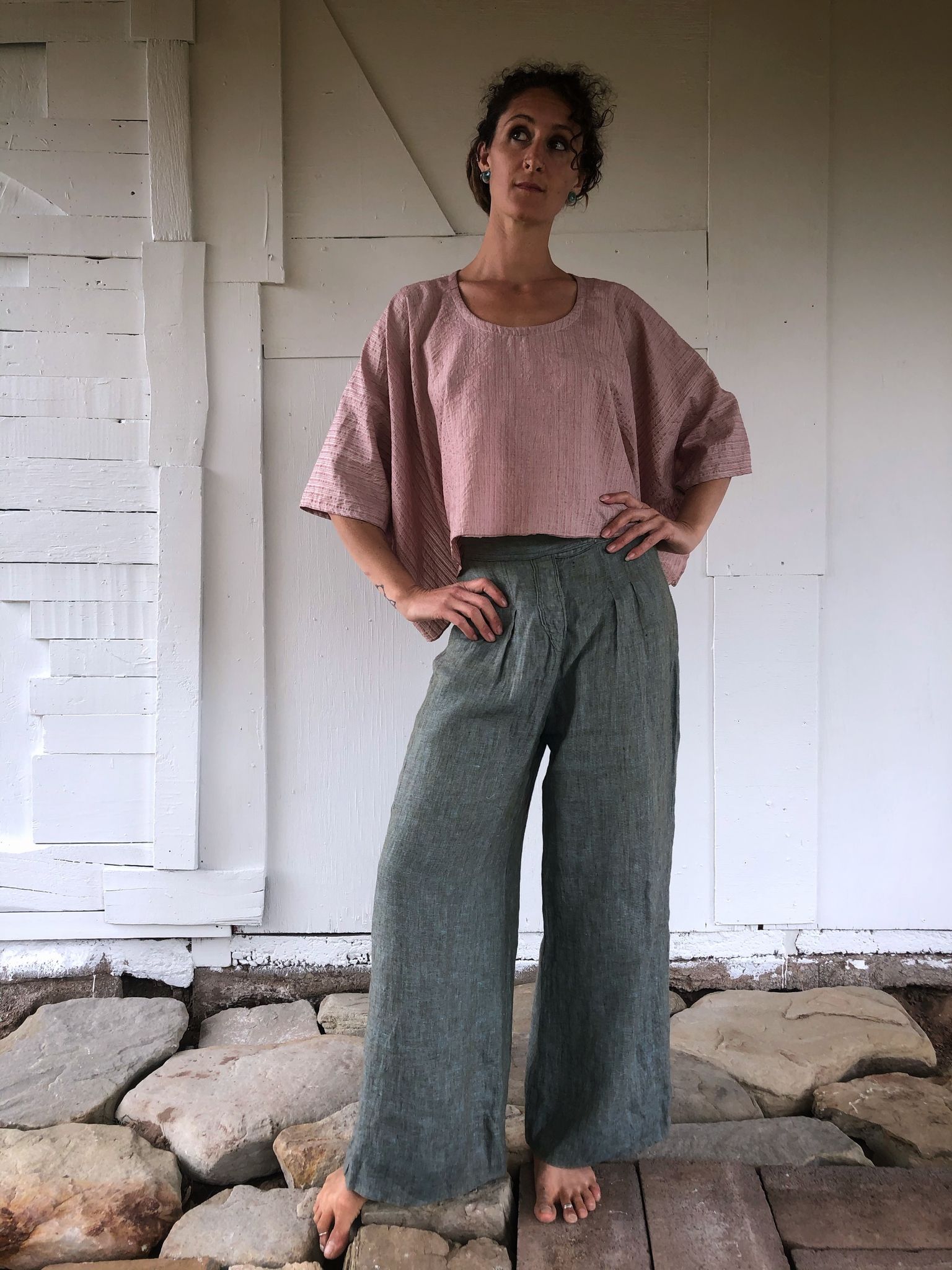 woman wearing Pink striped hand sewn silk shirt and blue pants