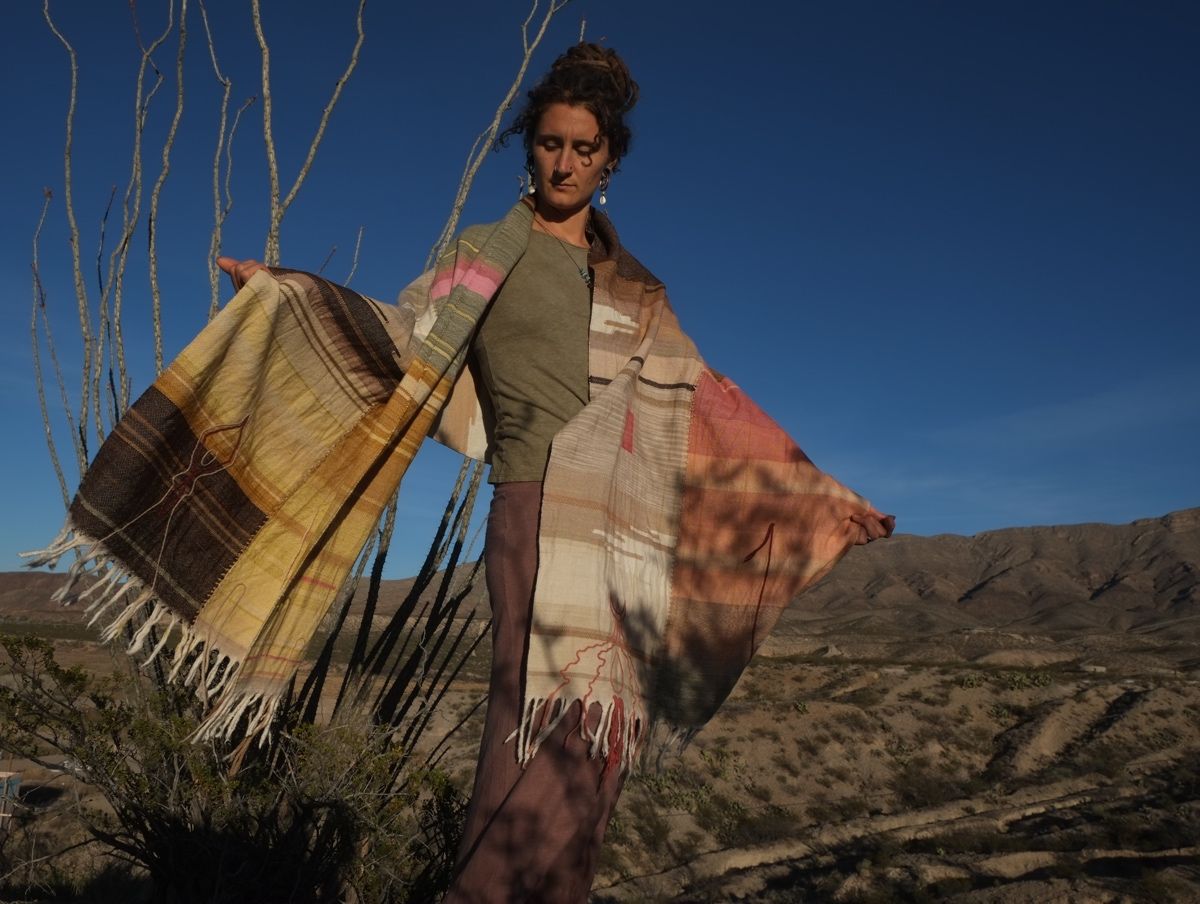 Woman wearing Handwoven Naturally Dyed Merino Blanket in the desert