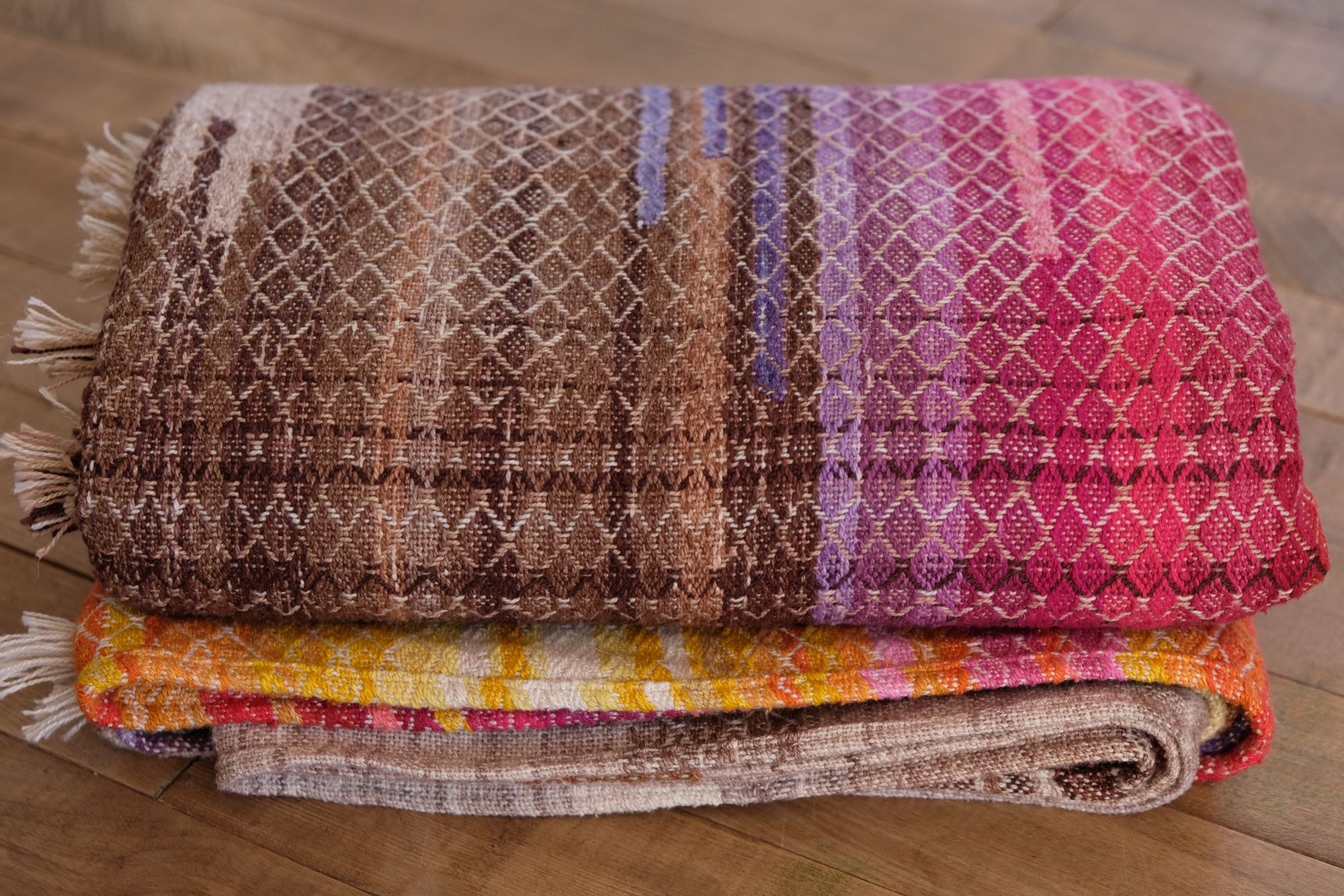 folded Handwoven, highly textures Diamond pattern fabric in every color of the rainbow, with natural browns and tans