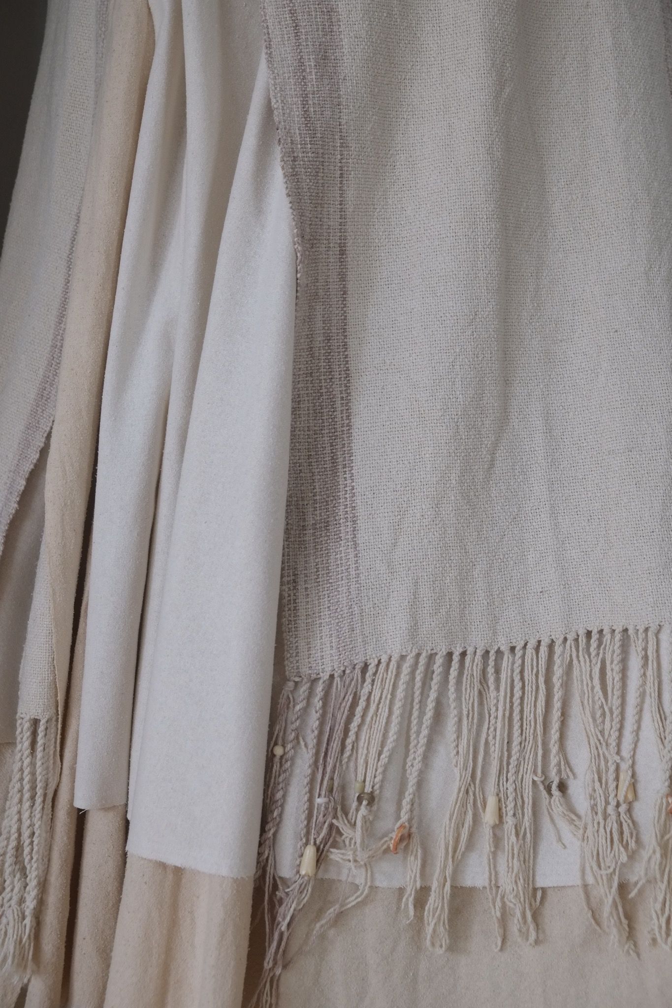 detail of handwoven highly textured fringe wedding skirt