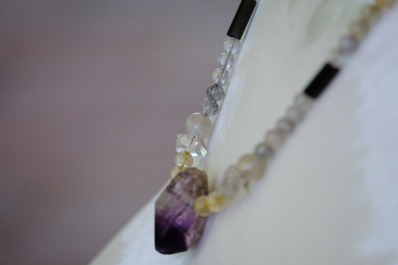 White female mannequin wears Deep purple amethyst and Quartz stones necklace