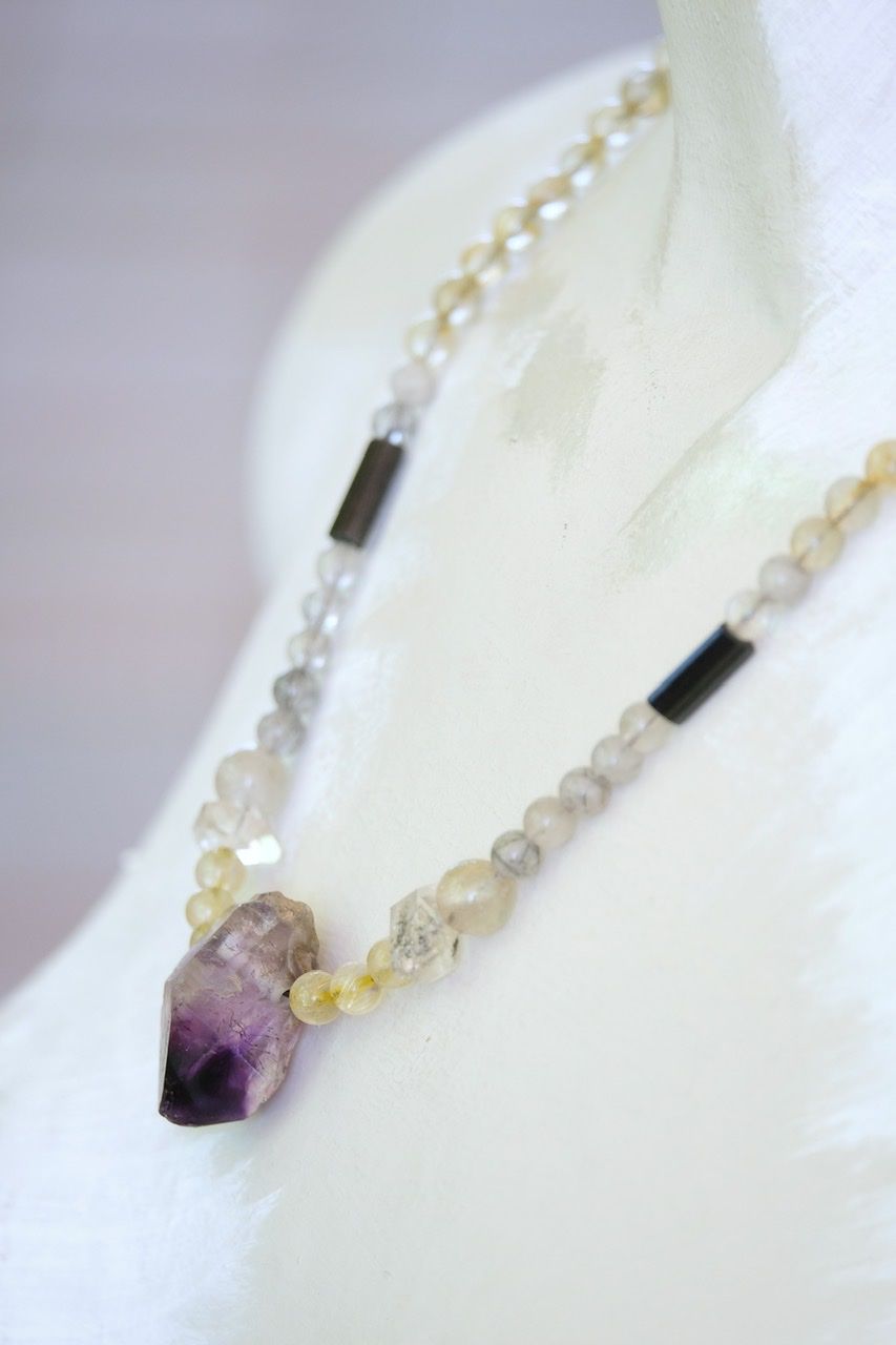 White female mannequin wears Deep purple amethyst and Quartz stones necklace