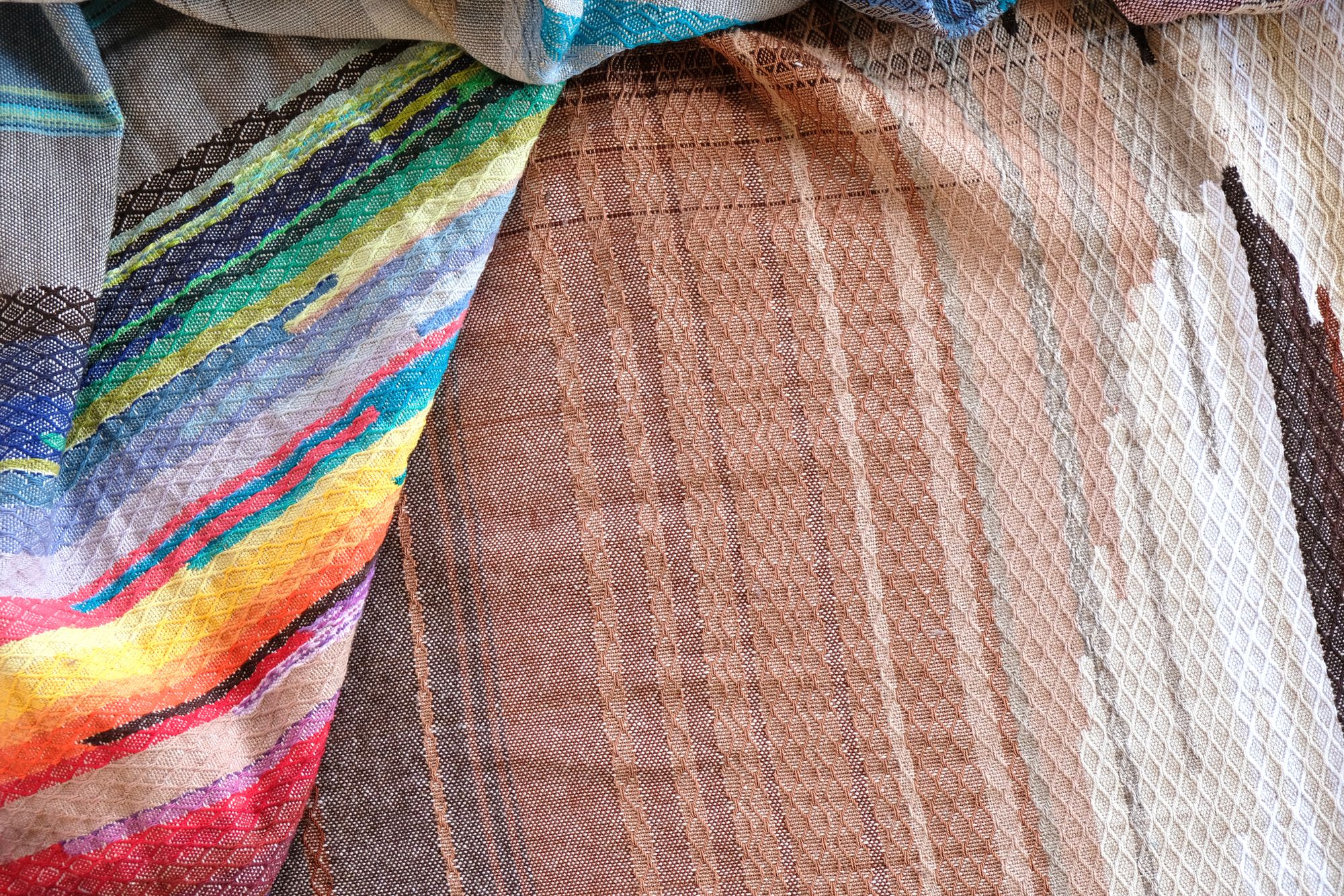 5 m of head oven rainbow colored fabric layers on a wooden floor