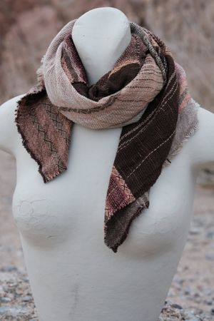 small peach, grey and brown scarf on a white mannequin