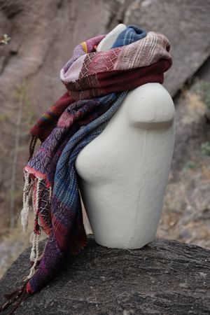 Detail of Rainbow Wool Handwoven Etherial Scarf on a white mannequin