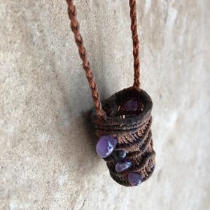 Small brown basket necklace with purple amethyst stones knotted into it