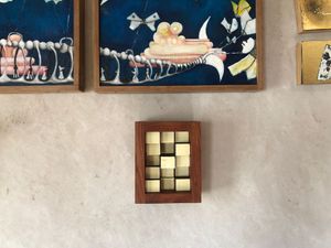 Wall mounted abstract sculpture in dark wood frame made from Ivory piano keys