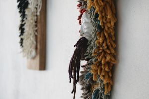Handwoven many-colored pile woven churro wool wall hanging sculpture