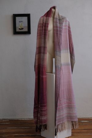 Handwoven fabric that is naturally dyed with cochineal in all shades of pink and fuchsia